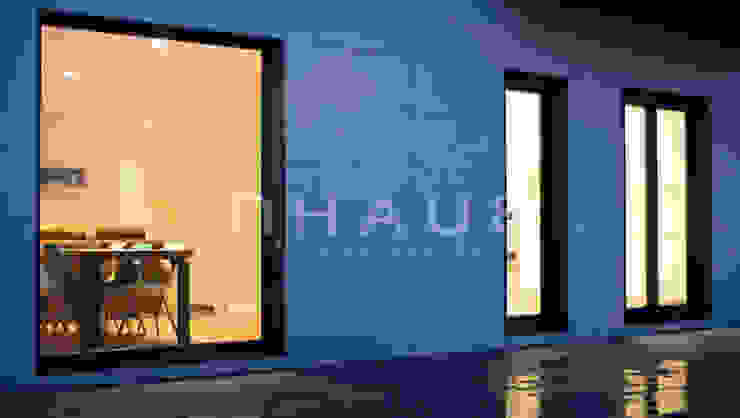 Fachadas ventiladas y ventanales de suelo a techo. de Casas inHAUS Moderno Cerámico