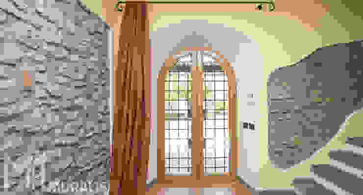 Porta finestra ad arco Muralisi, infissi dal 1987 Finestre in legno Legno Effetto legno finestre ad arco,finestra centinata,finestre in legno,infissi in alluminio,legno alluminio,porta finestra,infissi in legno,serramenti in legno,serramenti alluminio,finestra con grata