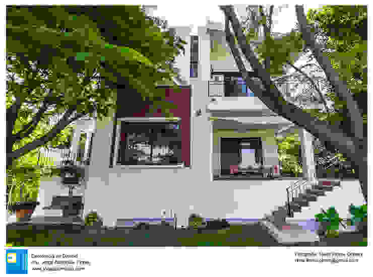 Fachada y jardín posterior René Flores Photography Casas modernas