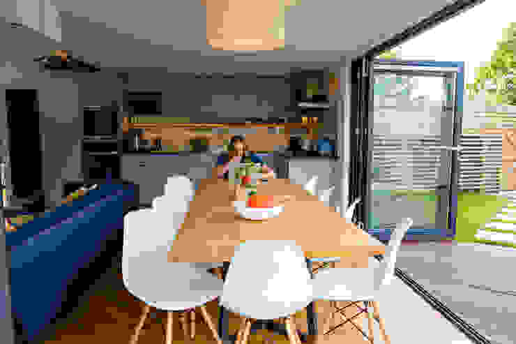 View of dining and kitchen spaces from bi-folding doors dwell design ห้องทานข้าว