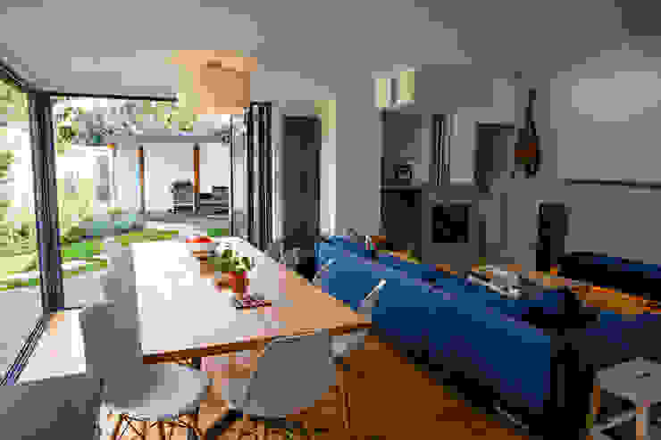 View of open-plan dining and living spaces from kitchen dwell design ห้องทานข้าว
