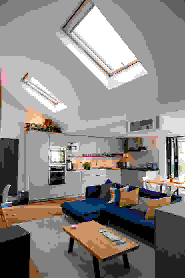 View of open-plan kitchen and living spaces and roof windows dwell design ห้องนั่งเล่น