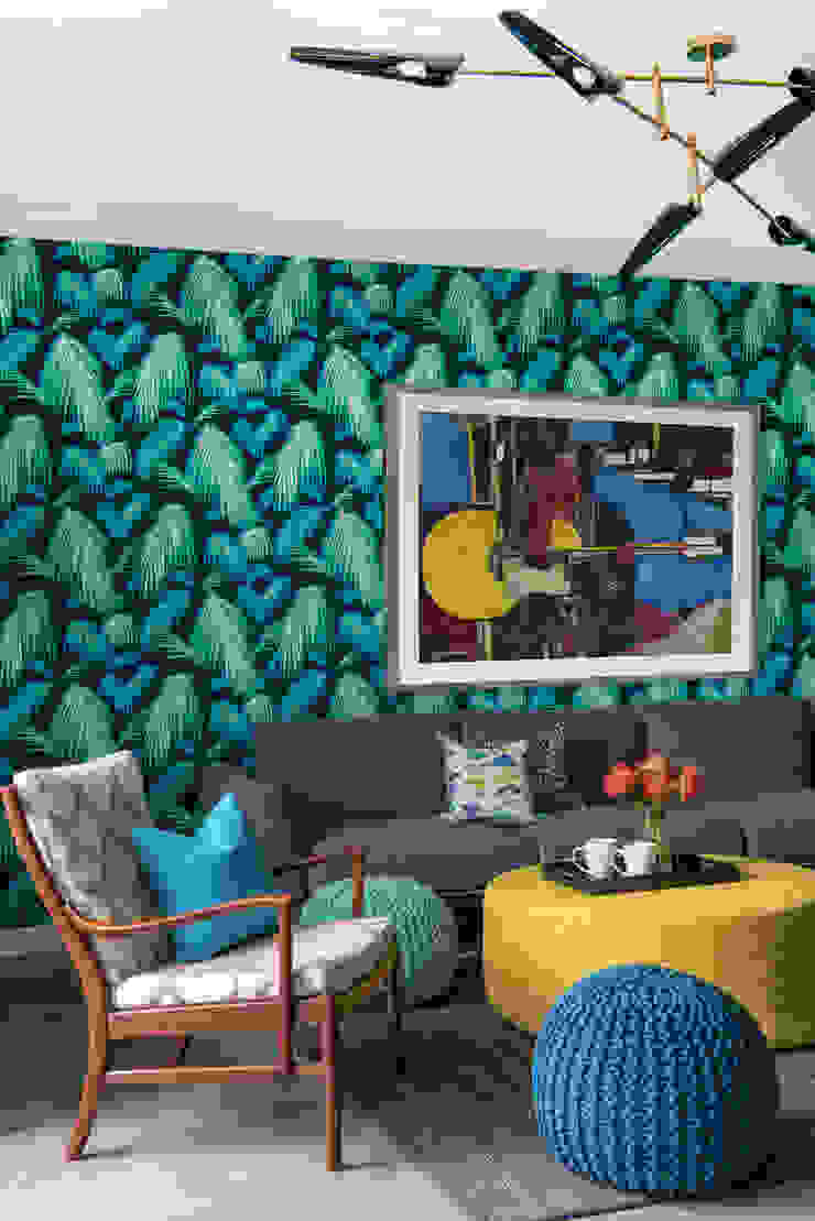Colourful Mid-century Style Family Room Design Intervention Modern living room Retro family room design, Coltrane chandelier, colourful cushions, ottoman décor ideas, mid-century chair, family room sofa design idea, family room artwork décor, Matthew Williamson Tropicana wallpaper, palm leaf wallpaper design
