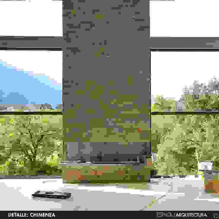 Detalle de chimenea con recubrimiento de piedra en Monterrey | homify