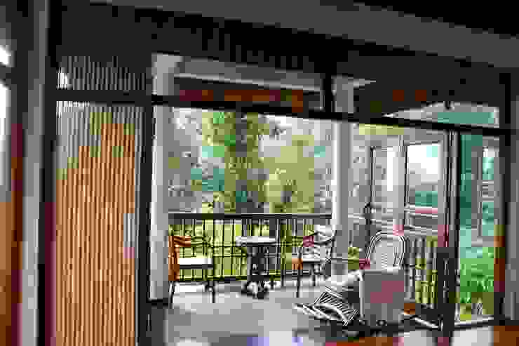 Sitout Benny Kuriakose Balcony Table,Plant,Wood,Shade,Interior design,Fixture,Door,Chair,Tree,Floor