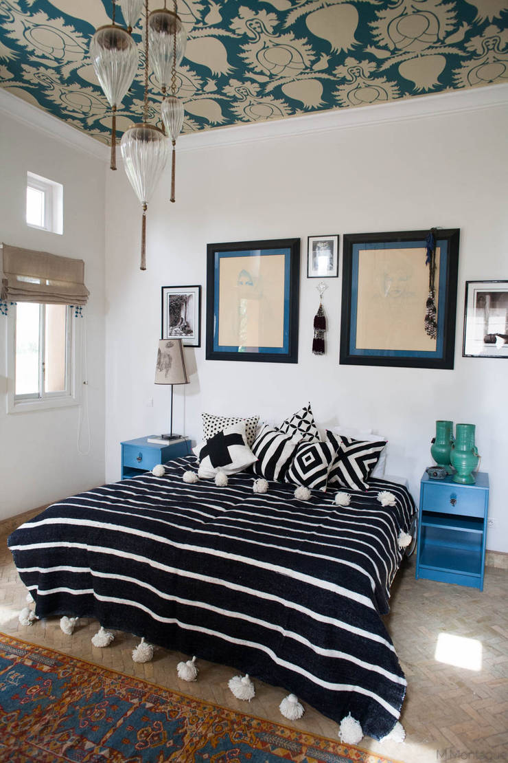 Georgeous Bedroom With Moroccan Pom Pom Blanket And Stylish