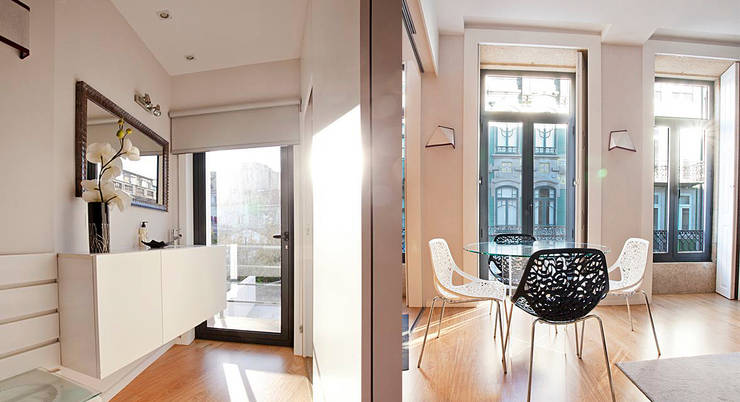 Edifício habitacional: Salas de estar ecléticas por Alves Dias arquitetos