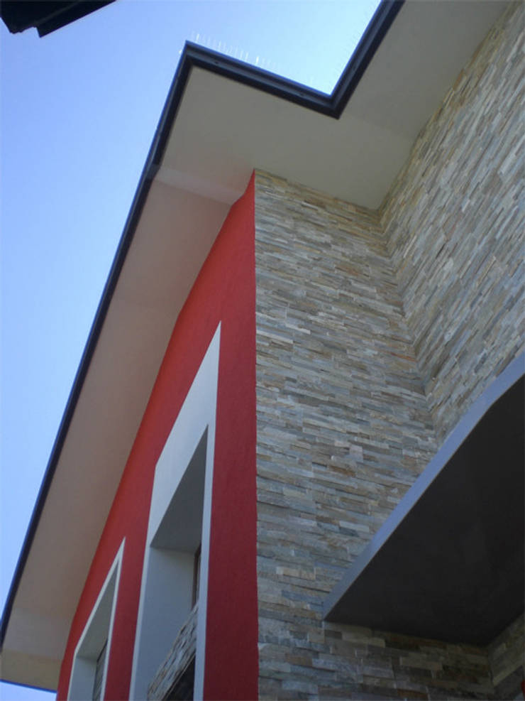Villa_FV: Case in stile  di Studio GIOLA | Casorezzo MI, Moderno Pietra  
