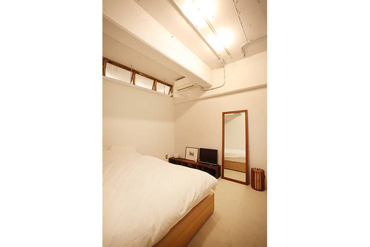 Dormitorios de estilo  por SWITCH&Co.