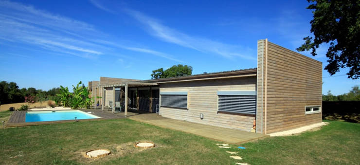 Casas de madera de estilo  por Rusticasa