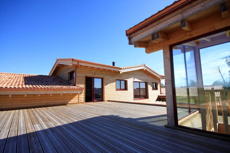 Casas de madera de estilo  por Rusticasa