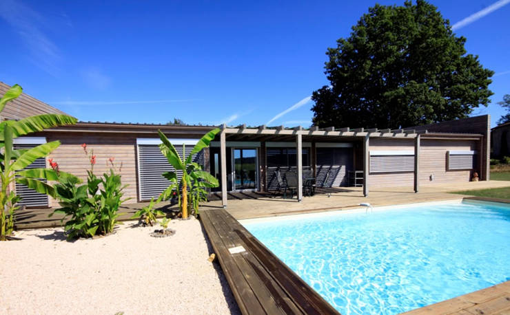 Casas de madera de estilo  por Rusticasa