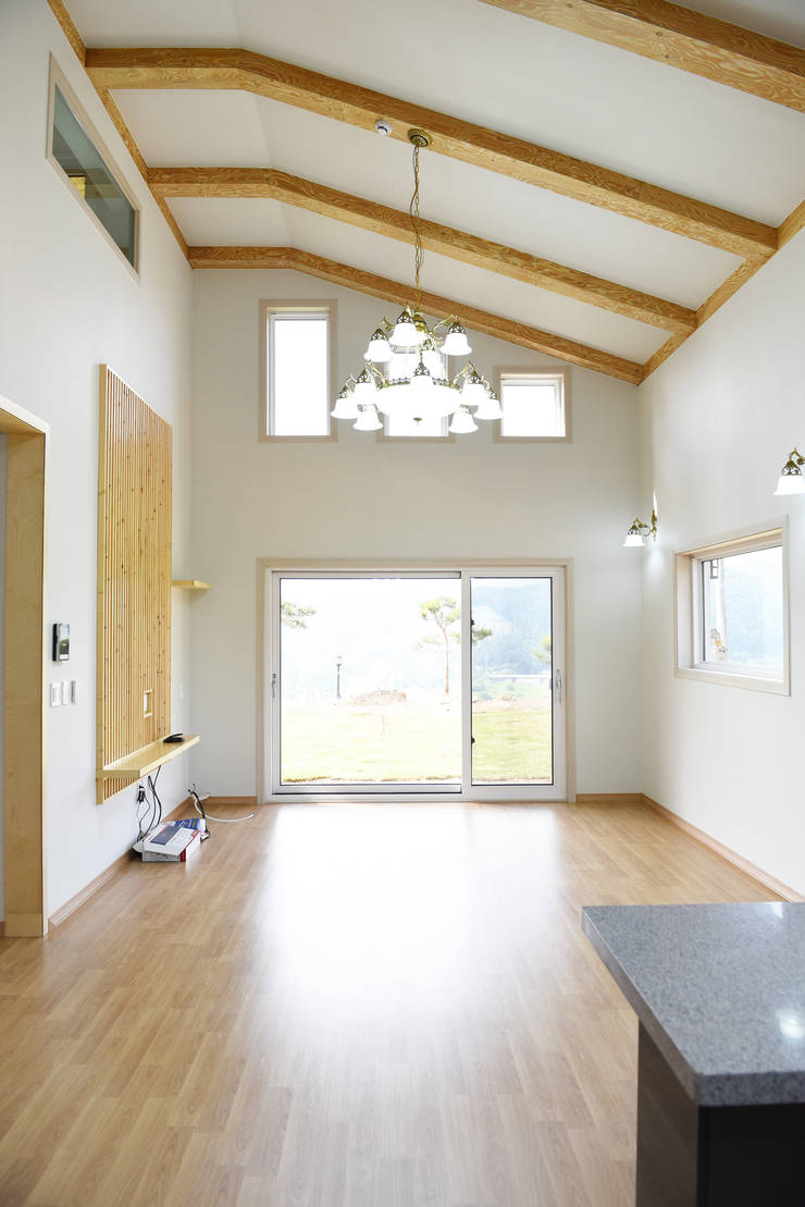 Salas / recibidores de estilo  por 한다움건설