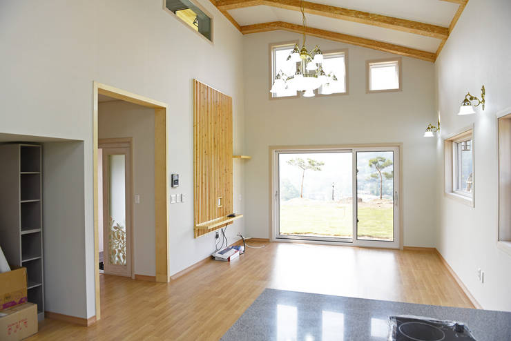 Salas / recibidores de estilo  por 한다움건설