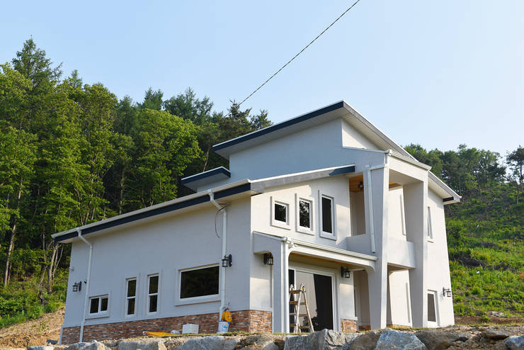 Casas de estilo  por 한다움건설
