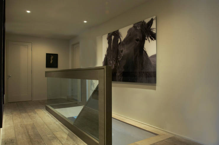 Pasillos y vestíbulos de estilo  por andretchelistcheffarchitects