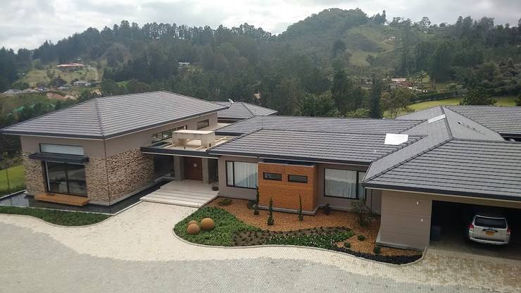 Projekty,  Dom rustykalny zaprojektowane przez Espacios Positivos