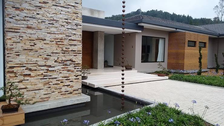 Projekty,  Dom rustykalny zaprojektowane przez Espacios Positivos