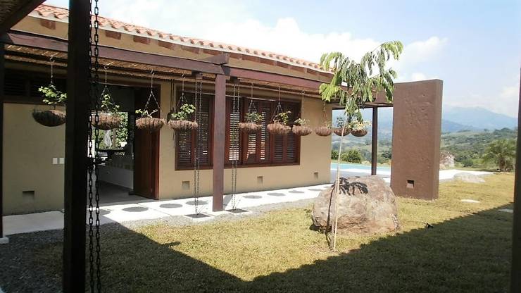 Projekty,  Dom rustykalny zaprojektowane przez Espacios Positivos