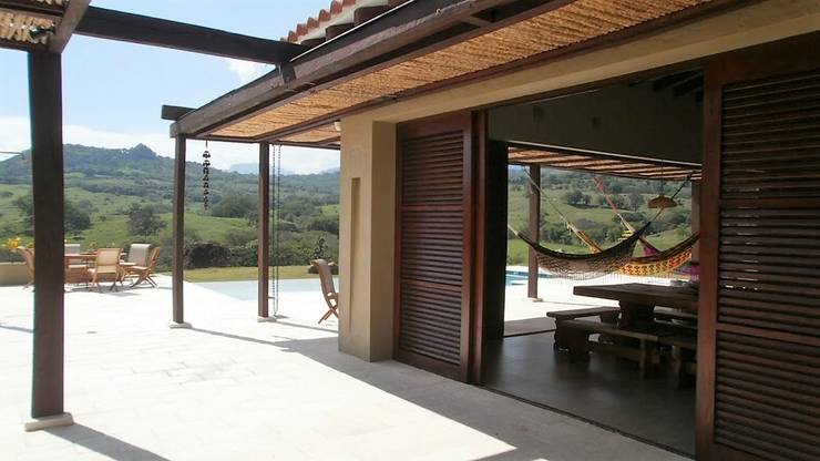 Projekty,  Dom rustykalny zaprojektowane przez Espacios Positivos