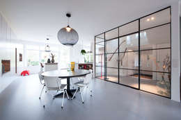 Salas de jantar modernas por StrandNL architectuur en interieur