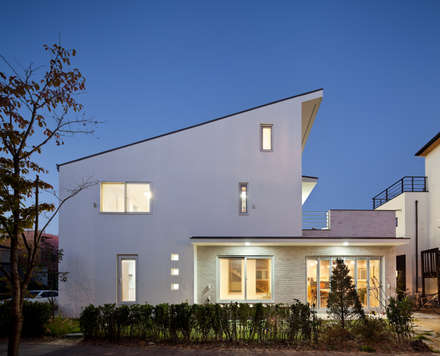 Modern houses by 남기봉건축사사무소 Modern houses by 남기봉건축사사무소