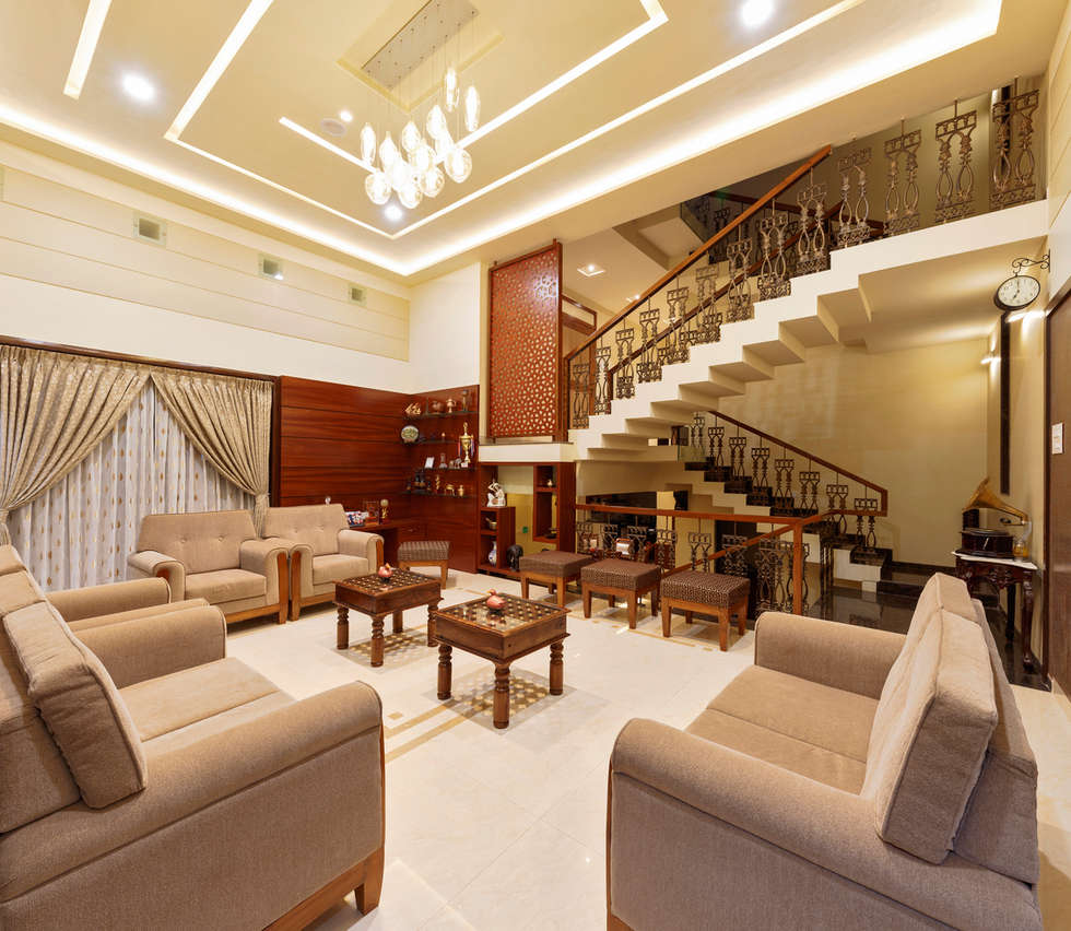 Double height living hall: tropical living room by ...