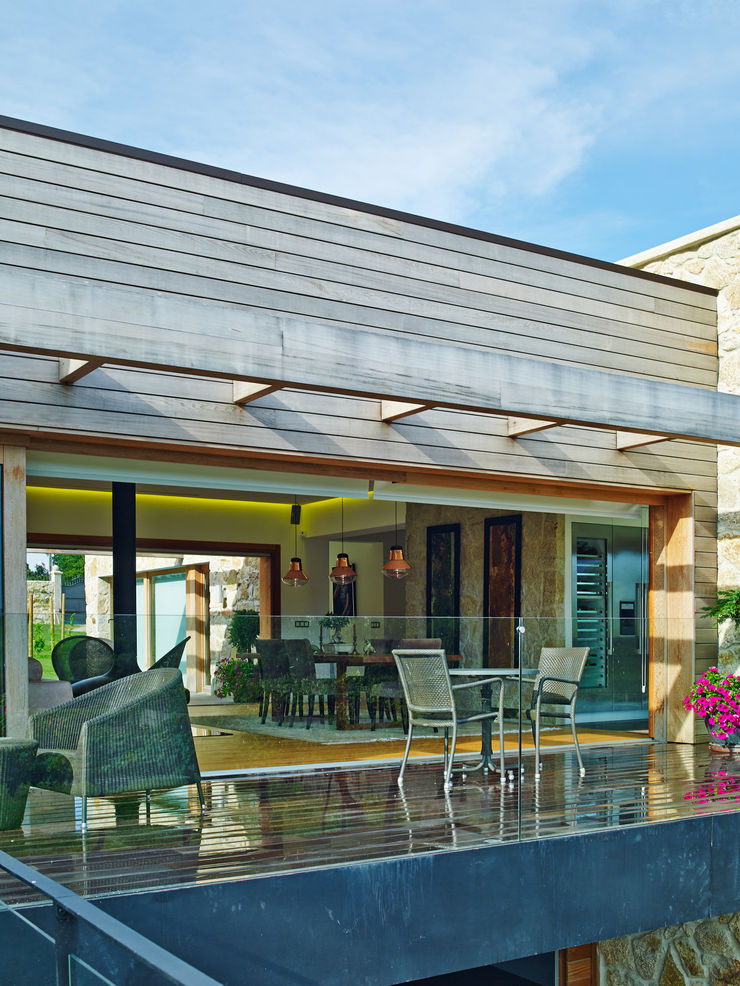 HUGA ARQUITECTOS Case in stile rustico