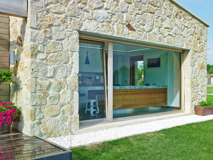HUGA ARQUITECTOS Case in stile rustico