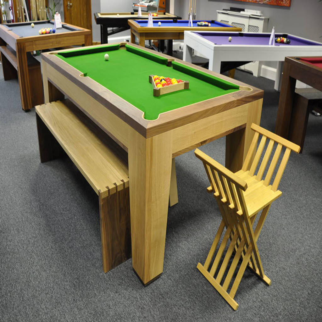 Spartan pool/dining table with benches and stool. homify