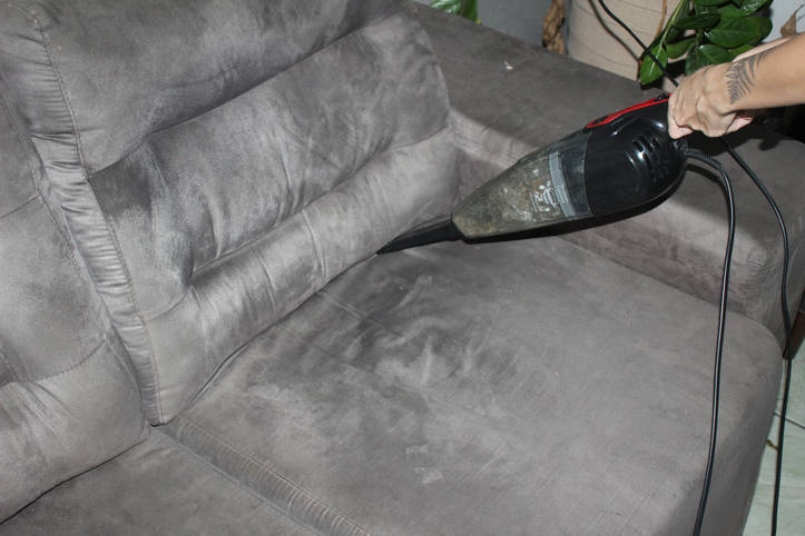 How do you clean a suede sofa or armchair?