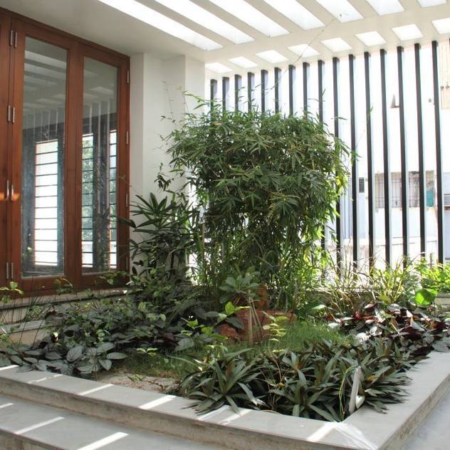 Jardines de estilo moderno por Muraliarchitects