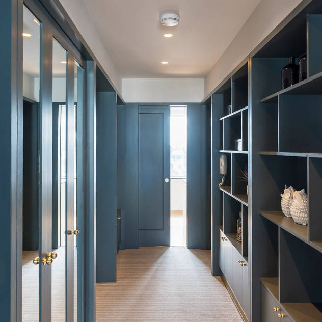 Hallway with shelving. Gundry & Ducker Architecture Modern Corridor, Hallway and Staircase Wood Blue storage shelving mirrors cupboards