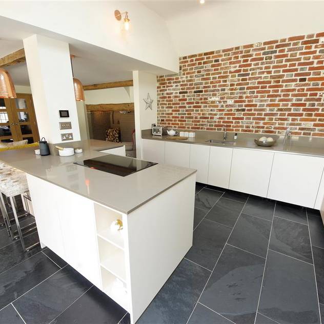 Modern kitchen with Brick wall feature PTC Kitchens Modern kitchen Wood effect