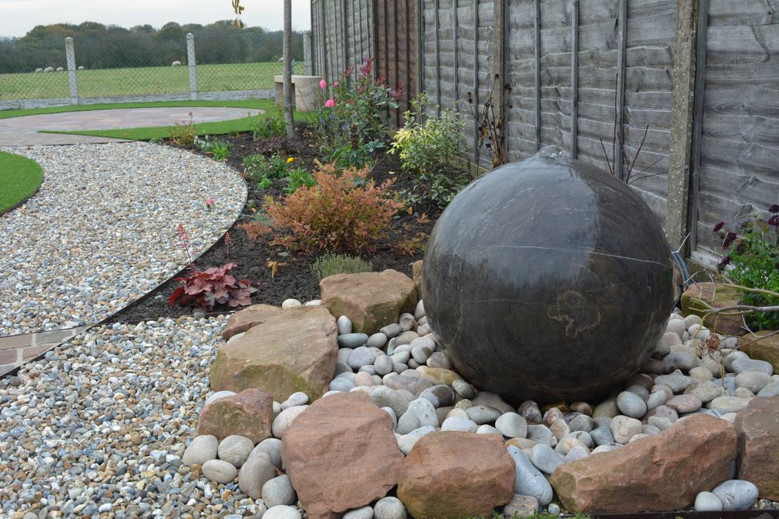 NATURAL STONE DRILLED SPHERE WATER FEATURES by BARTON FIELDS