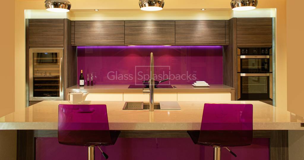 Vibrant purple glass splashback in modern zebrano kitchen with