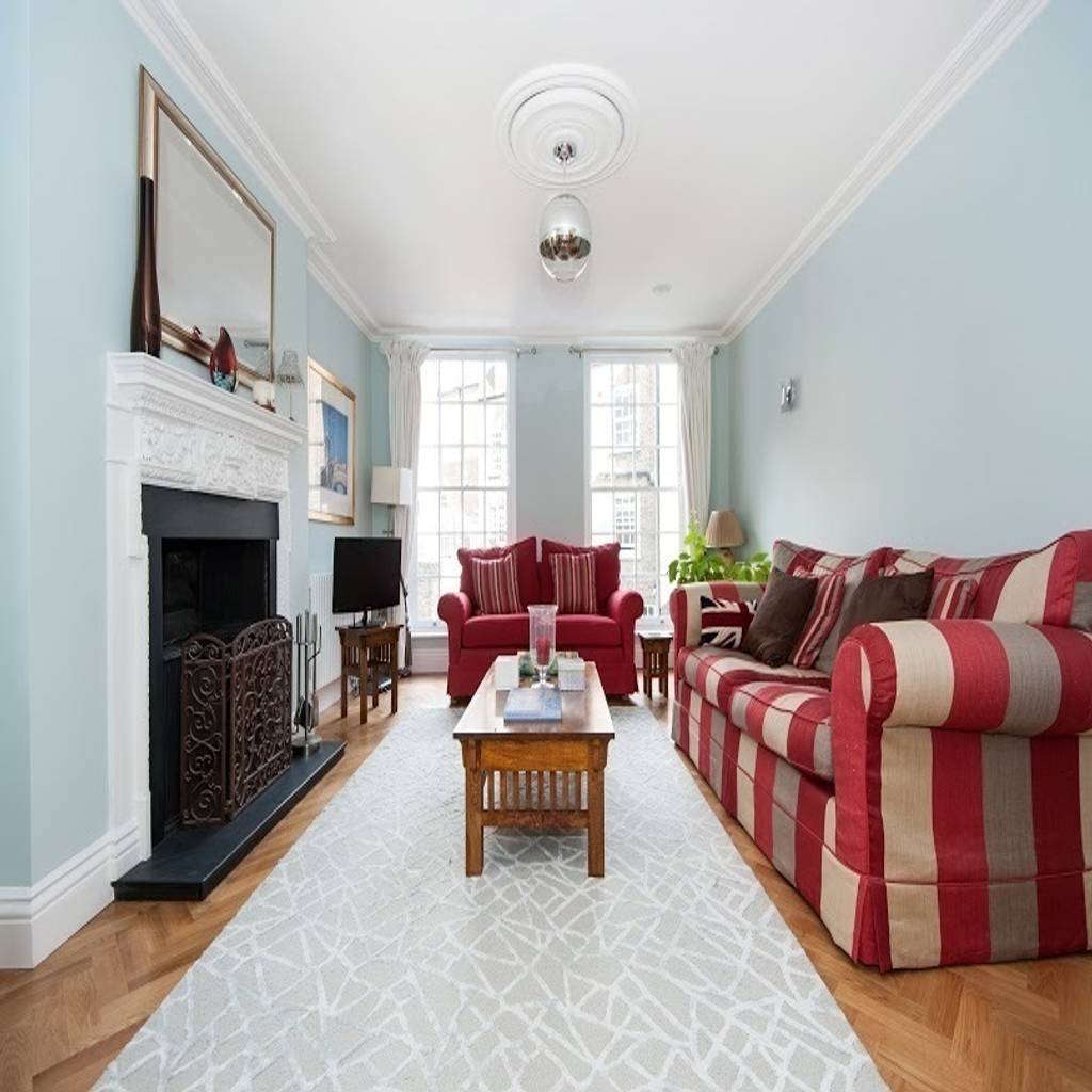 Early victorian townhouse corebuild salas de estar clássicas | homify