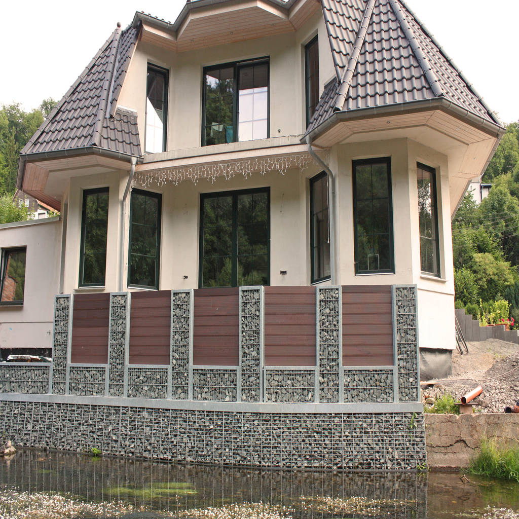 Gabionen als verkleidung einer maroden flussmauer von steelmanufaktur