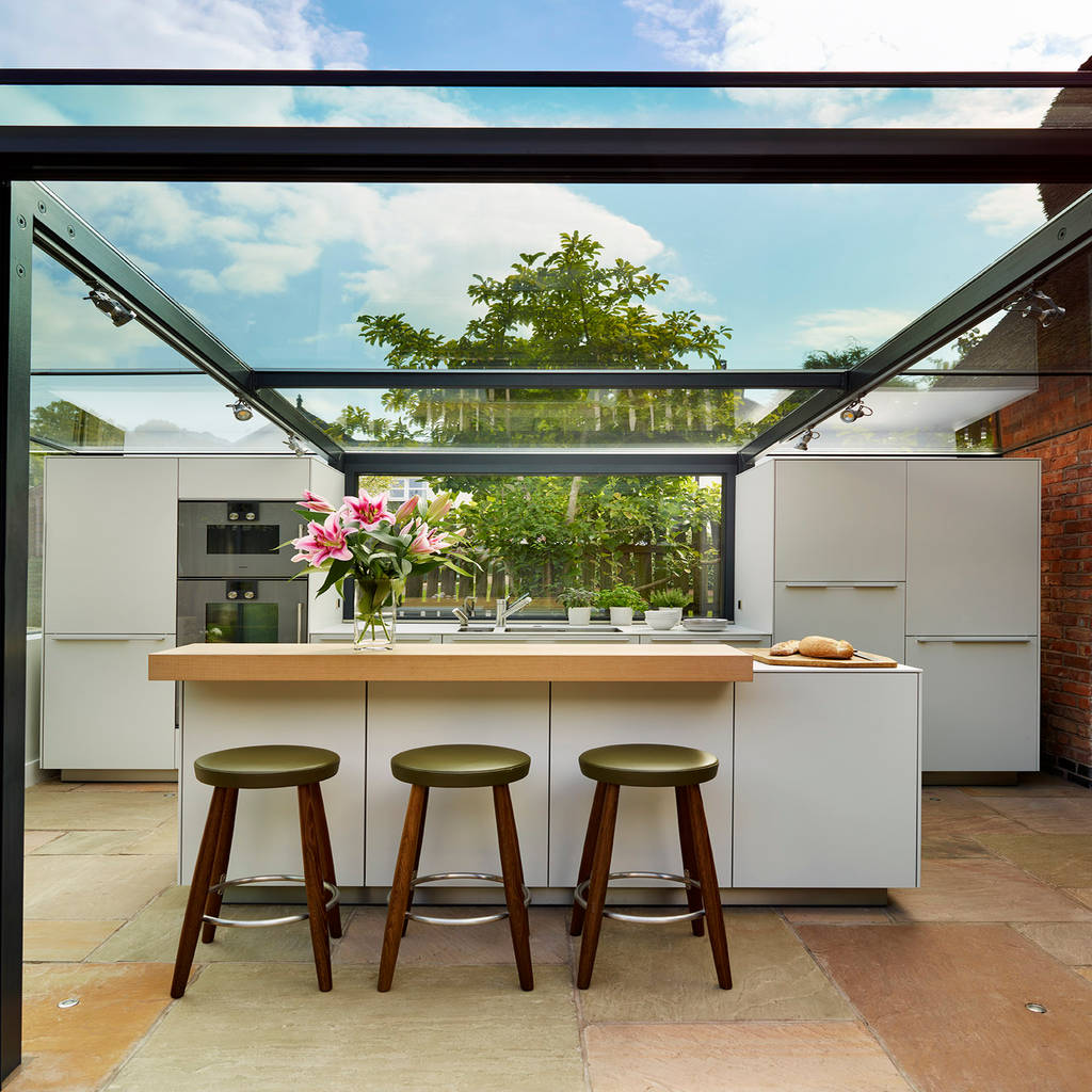 Glass box extension on thatched cottage kitchen architecture country