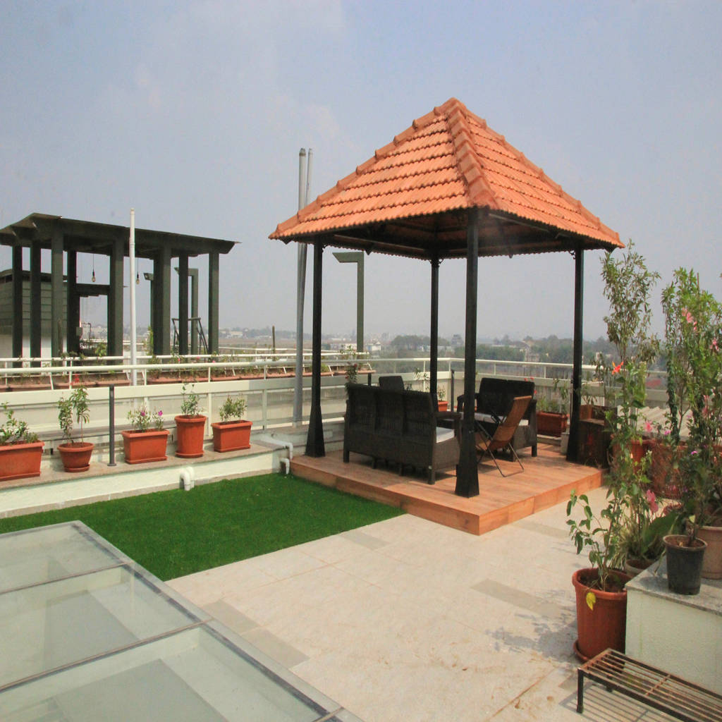 Perennial flowers around gazebo in the terrace homify
