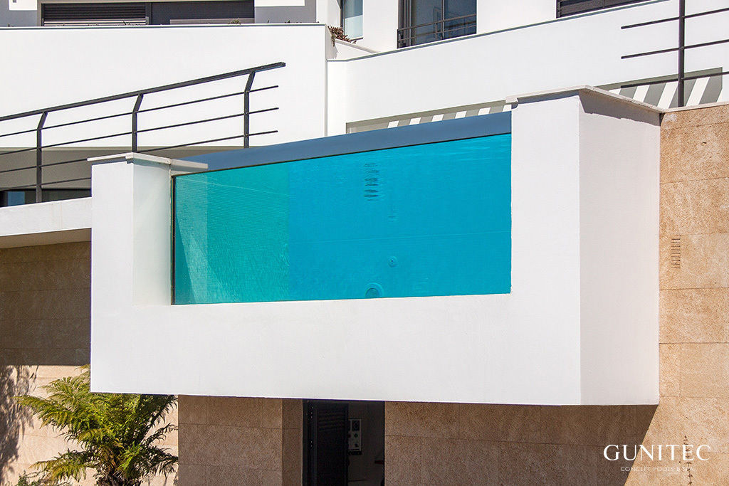 Piscina con pared de cristal, Gunitec Concept Pools Gunitec Concept Pools Jardines Piscinas y estanques