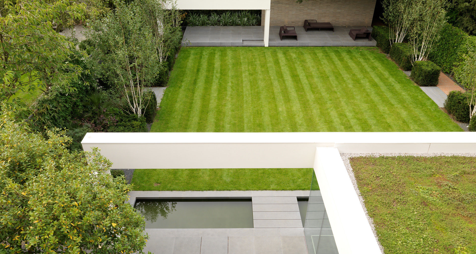 A Stunning and Spacious House Project in Wimbledon, Gregory Phillips Architects Gregory Phillips Architects สวน