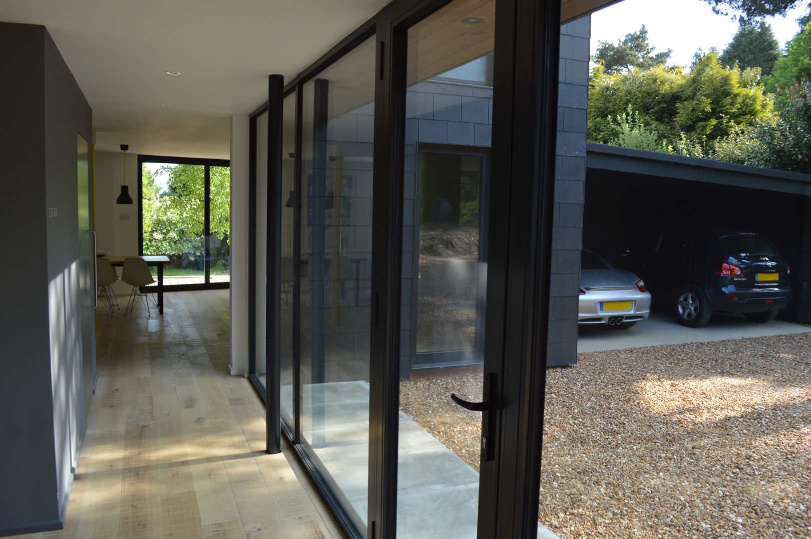 Fully Glazed Dual Aspect Entrance Hall ArchitectureLIVE Garage/shed dual aspect,entrance hall,full height glazing,aluminium framed,double glazing,timber flooring