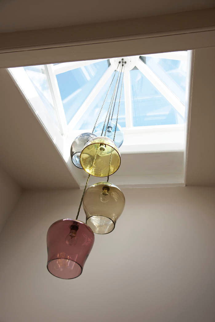 Bespoke glass chandelier suspended from a central skylight Concept Interior Design & Decoration Ltd Eklektik Koridor, Hol & Merdivenler Işıklandırma