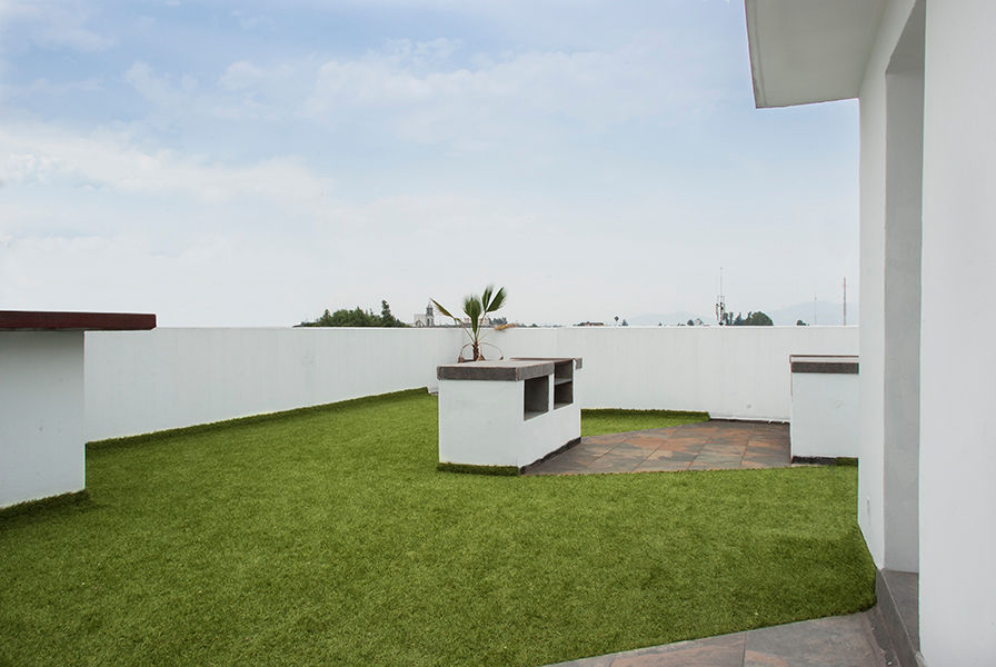 Roof Garden con asador RECON Arquitectura Casas modernas