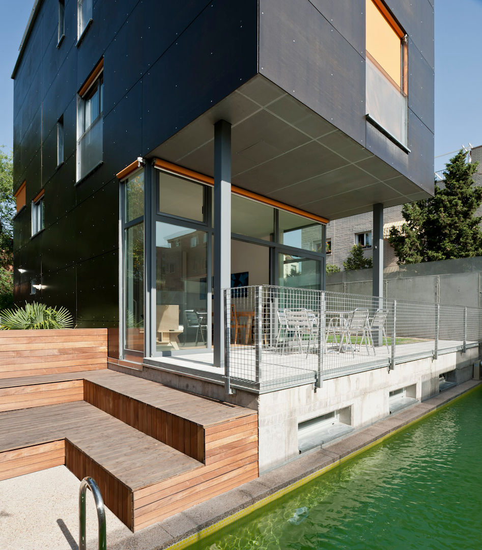 bikini 32 vivienda y estudio, hollegha arquitectos hollegha arquitectos Houses