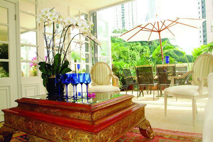 Guest Lounge Oui3 International Limited Colonial style houses Flower,Plant,Table,Property,Furniture,Building,Decoration,Window,Wood,Interior design