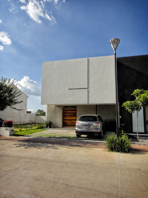 Casa Zaragoza, Abraham Cota Paredes Arquitecto Abraham Cota Paredes Arquitecto Дома в стиле модерн