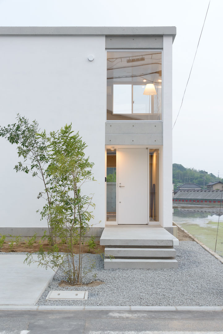 笑顔とsky-line, 風景のある家.LLC 風景のある家.LLC Casas industriales Concreto