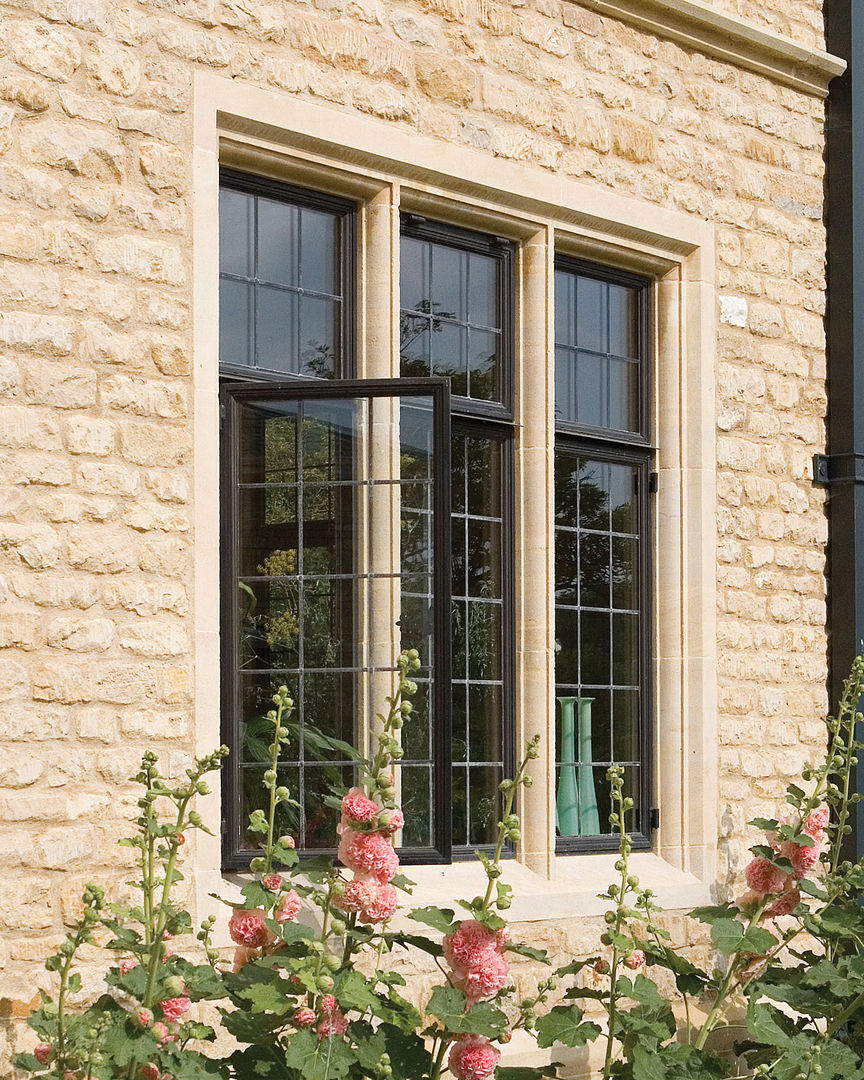 Stone New Build with Advanced Bronze Casements homify Classic windows & doors Metal Windows